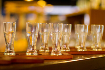 Tequila cups close-up in a wooden bar