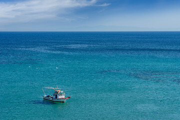 Fishing boat floating on the sea. Aegean Sea - Turkey