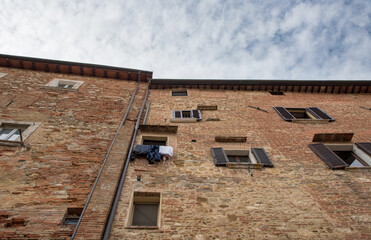Fototapeta na wymiar Historical architecture buildings, Montepulciano, city Tuscany, Italy against blue sky