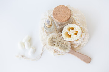 Fototapeta na wymiar Waste-free starter kit for facial cleansing. Loofah, brush, silkworm sponge. Plastic-free life concept, zero waste.