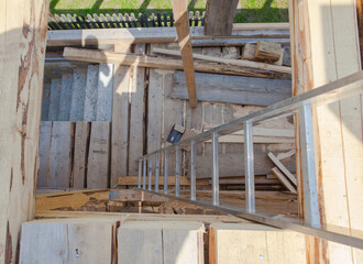 stairs and ladder on new house construction made of wood