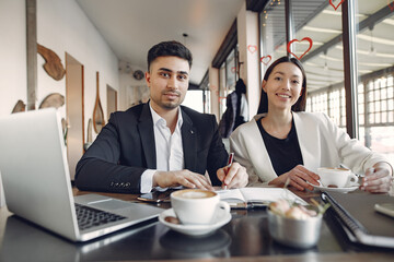 Stylish businessman working in a office and use the phone