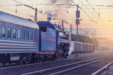 Fototapeta na wymiar Retro steam train at sunset time. Moscow.