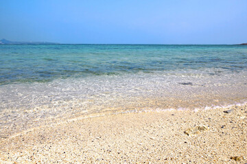 Fototapeta na wymiar Beautiful Okinawan beach with clear water waves