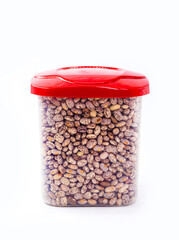 plastic pot to store culinary ingredients, brazilian beans on isolated white background