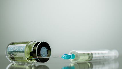 Covid-19 vaccine, canister and syringe