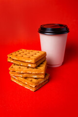 Fototapeta na wymiar Hungarian waffles with caramel filling and cup of coffee