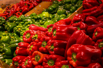 Red peppers with green peppers in background at local farmers market