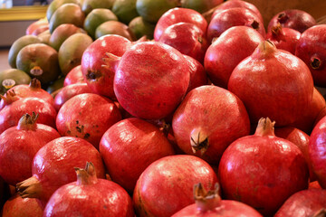 Fresh red pomegranates at the local farmers market