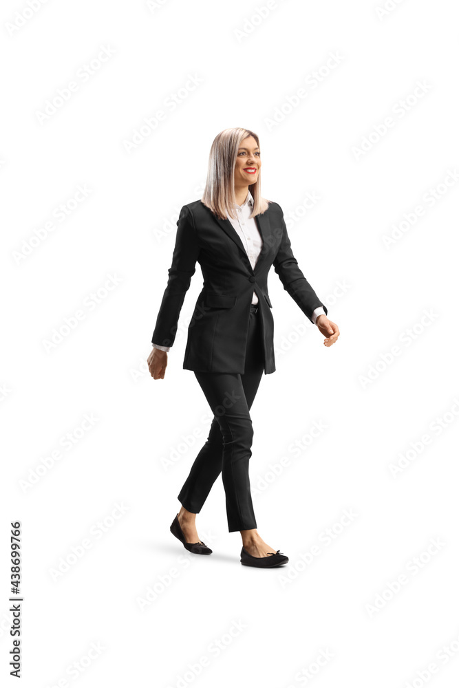 Sticker Full length shot of a young businesswoman in flat shoes walking