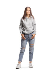 Full length portrait of a young female wearing a hoodie and ripped jeans - obrazy, fototapety, plakaty
