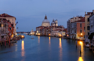 Fototapeta na wymiar The Grand Canal at sunset with the Santa Maria della Salute basilica in the background, Venice, Italy
