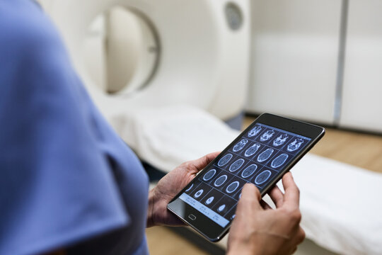 Clinic: Anonymous Nurse Holding Digital Tablet In CT Room