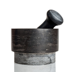 kitchen mortar with a pestle made of natural stone, a mortar is a tool for pounding and grinding, the product is placed in a mortar and is affected by an object of an oblong shape with a pestle - obrazy, fototapety, plakaty