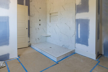 Renovation construction of master bathroom with new under construction bathroom interior drywall...