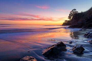 Sunset in Capitola with the beach turning pink.