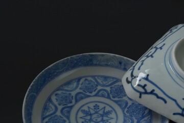 Lay out of picture plate. This is a very fine example of Japanese traditional antique &ldquo; imari ware &rdquo;.  black background・dim lighting soft focus image.