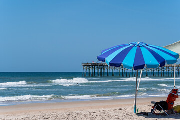 Beach Umbrella with Pier in Background