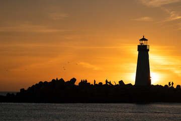 The Walton Lighthouse at the Santa Cruz, CA harbor at sunset.