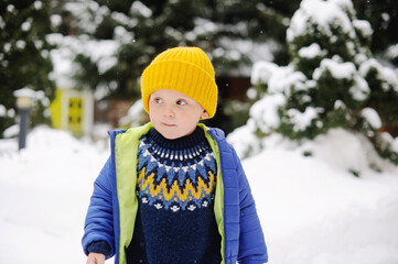 Baby boy in snow outside
