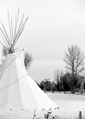 An authentic native american teepee in the winter snow in Wyoming, USA. 