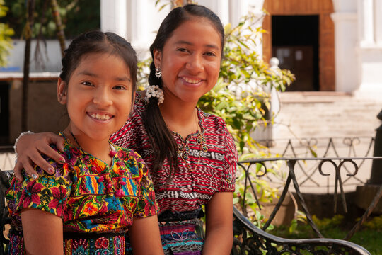 Portrait of happy indigenous girls smiling, looking at camera.