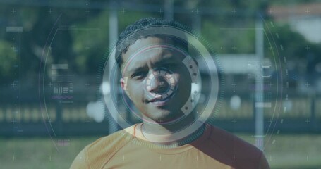 Scope scanning over digital interface with data processing against male soccer player smiling - Powered by Adobe