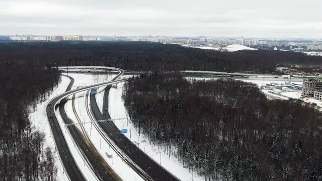 The road connecting cities. MKAD Moscow Russia. Transport connection aerial view in the daytime