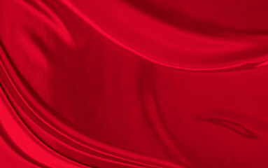 Black red satin dark fabric texture luxurious shiny that is abstract silk cloth background with patterns soft waves blur beautiful.
