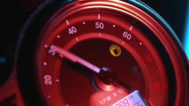 Inclusion of dashboard on modern classic motorcycle. LED display and analog tachometer hand. Close-up view, motorbike and cafe racers concept. 