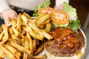 French fries and a hamburger at diner type restaurant.