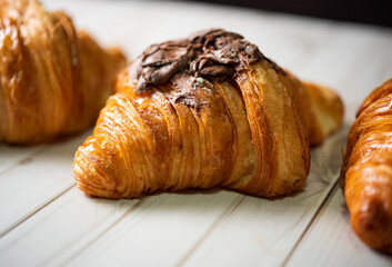 Croissant bakery on white wooden table