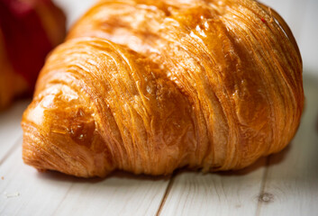 Croissant bakery on white wooden table