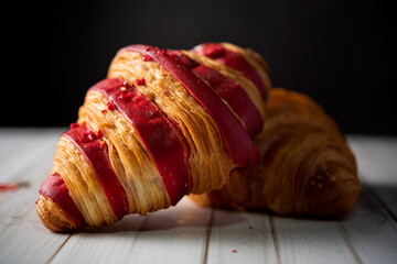 Croissant bakery on white wooden table