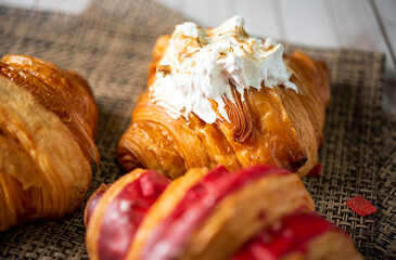 Croissant bakery on white wooden table
