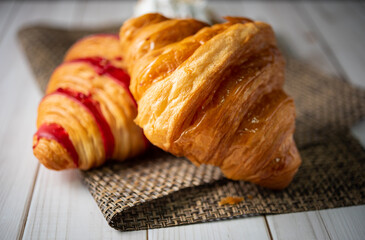 Croissant bakery on white wooden table