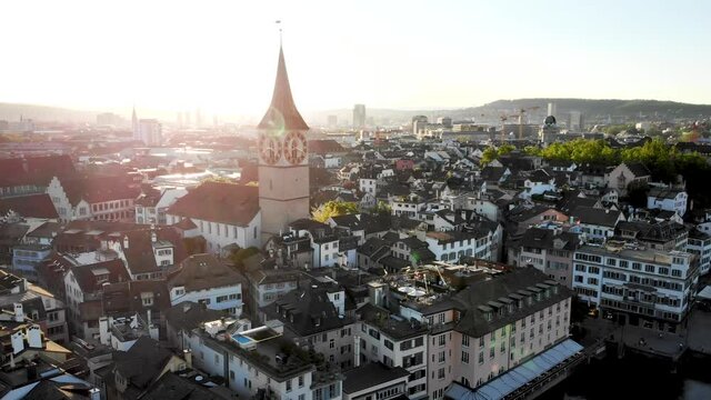 Aerial view of Zurich, Switzerland at sunset with St. Peter church