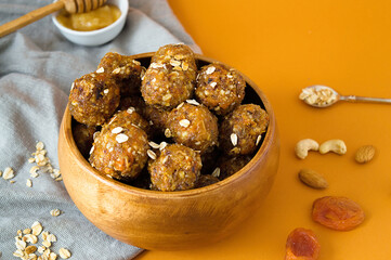 Raw energy balls. Candy vegan balls of dates, raisins, almonds, cashews, dried apricots, oatmeal.