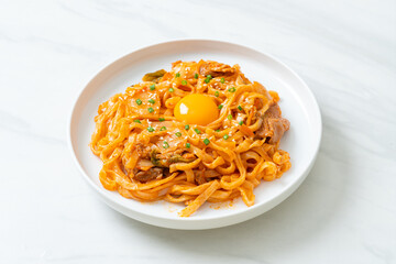 stir-fried udon noodles with kimchi and pork