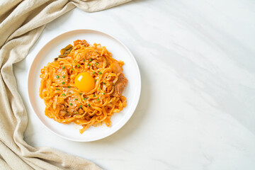 stir-fried udon noodles with kimchi and pork