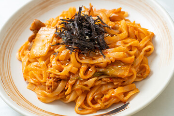 stir-fried udon noodles with kimchi and pork