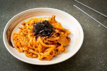 stir-fried udon noodles with kimchi and pork