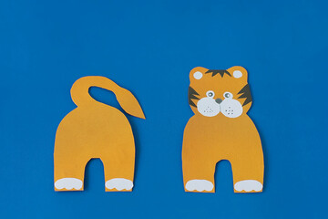 Step 5. Step by step instructions on how to make a tiger at home. Craft for New Year 2022. Take colored paper. A simple creative idea with your own hands. DIY children's art project