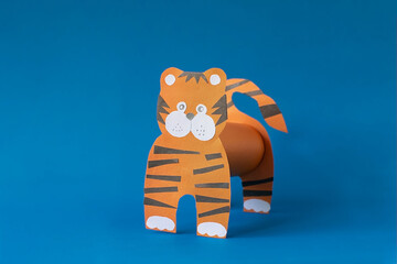 Step 6. Step by step instructions on how to make a tiger at home. Craft for New Year 2022. Take colored paper. A simple creative idea with your own hands. DIY children's art project