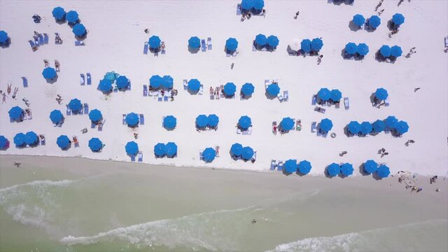 Drone Shot of Ocean and Blue Beach Umbrellas in Marco Island Florida