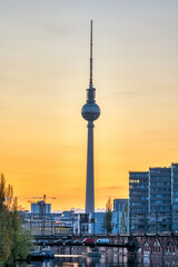 Fototapeta premium The famous Television Tower and the river Spree in Berlin at sunset