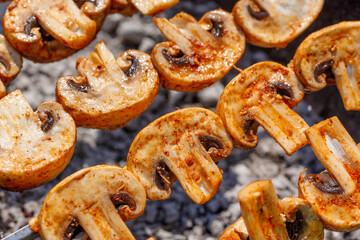 Barbecue skewers with grilled champignon mushroom kebab in a brazier