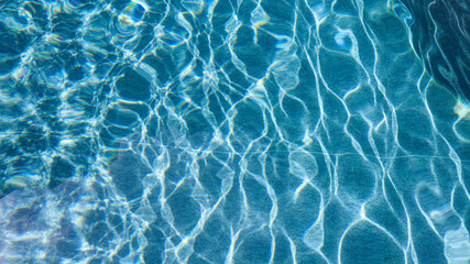 Abstract pool water.  Swimming pool bottom caustics ripple and flow with waves background surface...