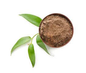 Dry henna powder in bowl on white background