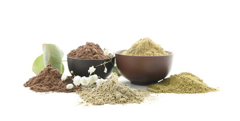 Dry henna powder in bowls on white background